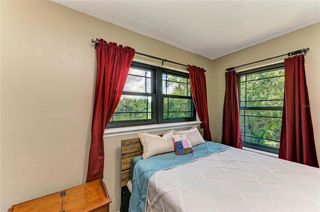 6114 Cypress Circle Bradenton, FL 34202 - Photo 52 of 67 a bedroom with a bed and a window