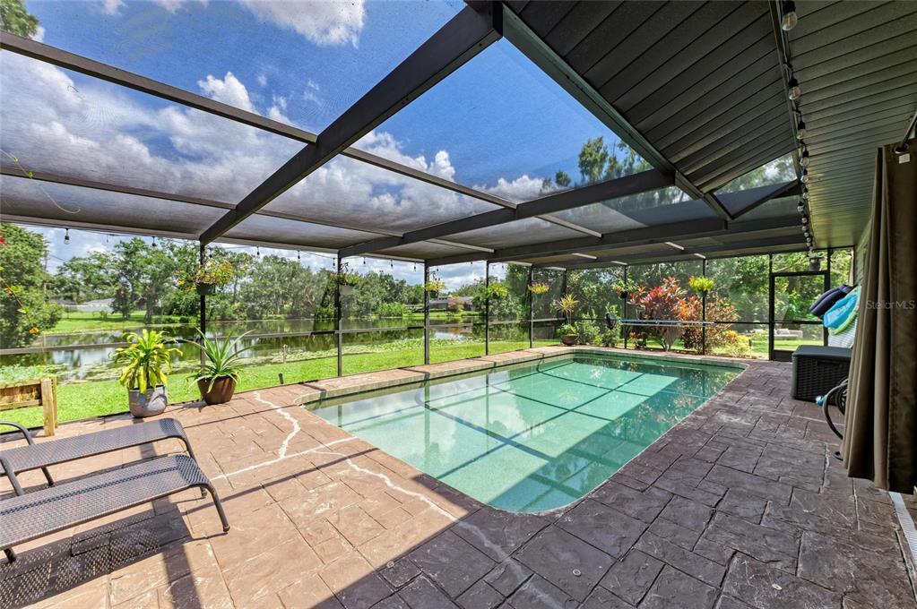 6114 Cypress Circle Bradenton, FL 34202 - Photo 58 of 67 a view of a backyard with sitting area
