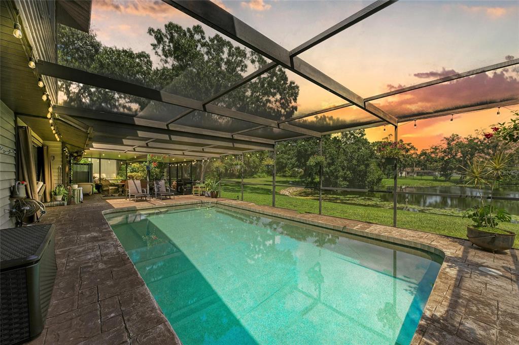 6114 Cypress Circle Bradenton, FL 34202 - Photo 61 of 67 a view of a swimming pool with a patio