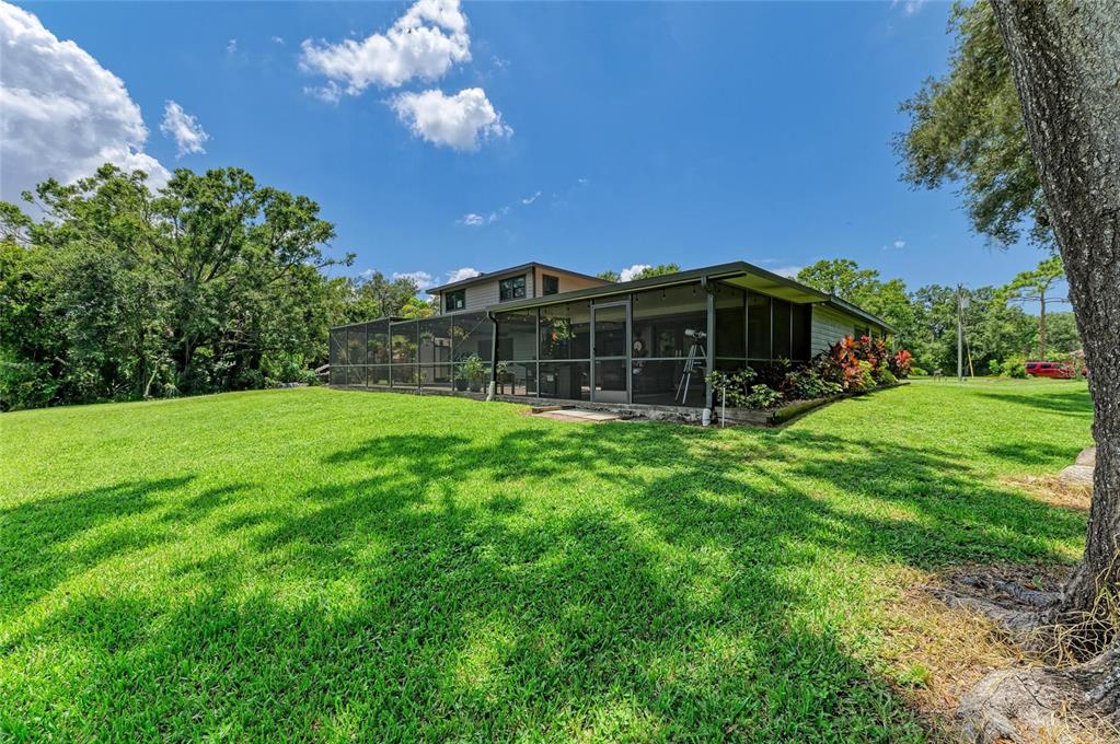 6114 Cypress Circle Bradenton, FL 34202 - Photo 66 of 67 a view of a house with a backyard