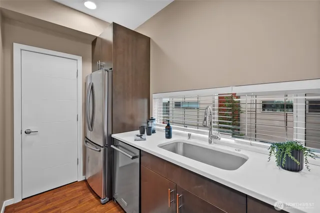 a kitchen with a sink and refrigerator