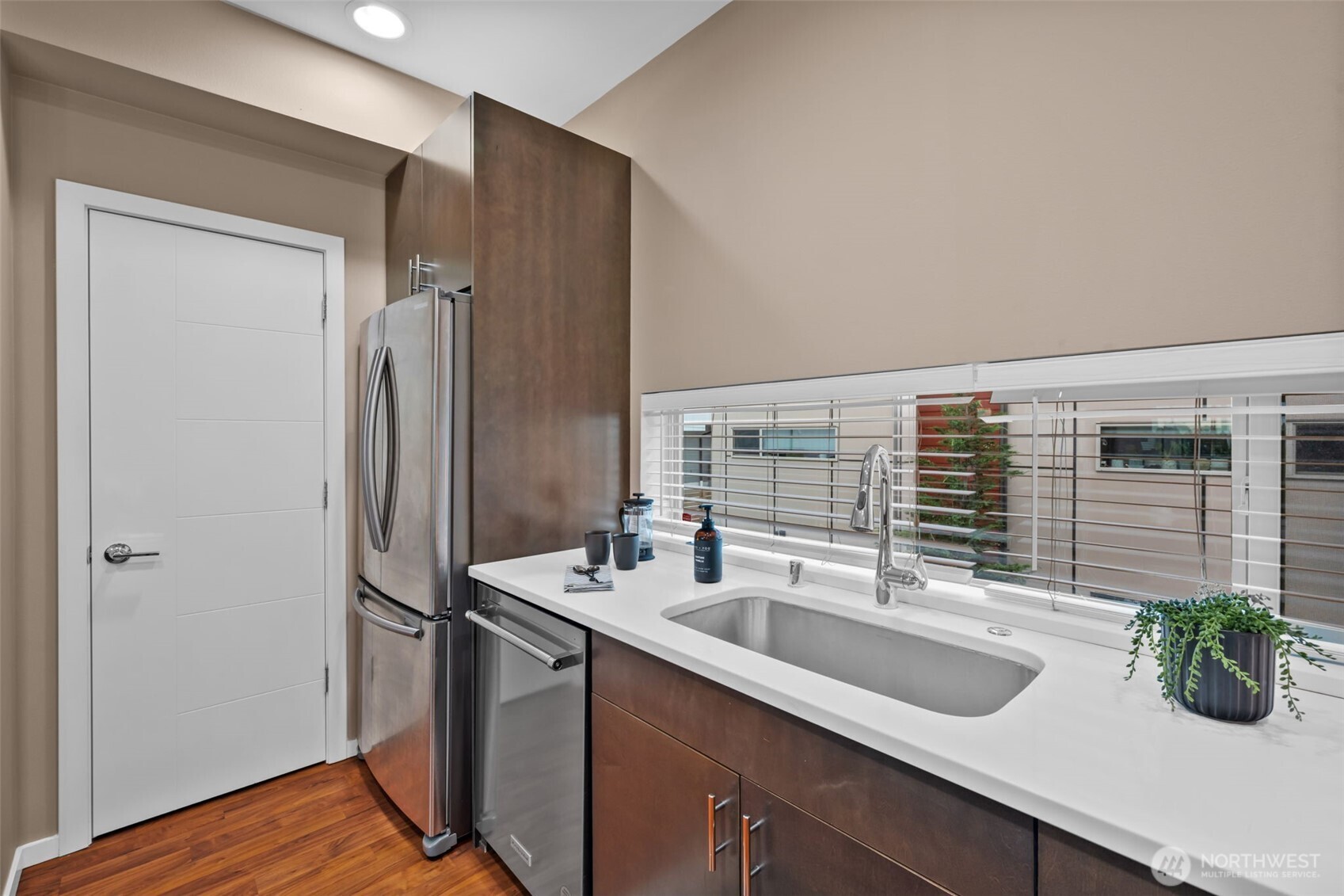2311 North 113th Place, Unit B Seattle, WA 98133 - Photo 12 of 36 a kitchen with a sink and refrigerator