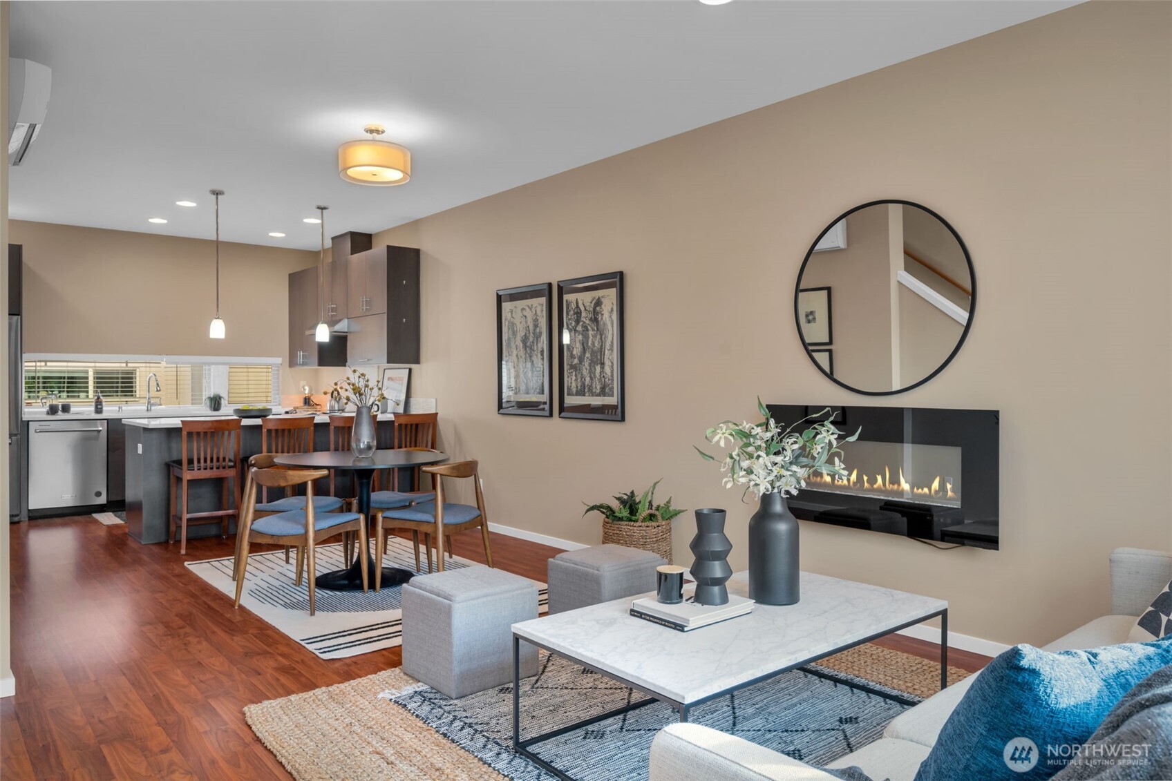 2311 North 113th Place, Unit B Seattle, WA 98133 - Photo 22 of 36 a living room with furniture a table and kitchen view