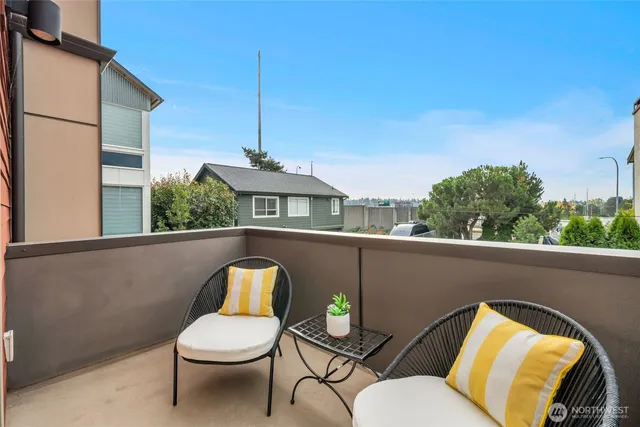 a bed room with a bed and a chair