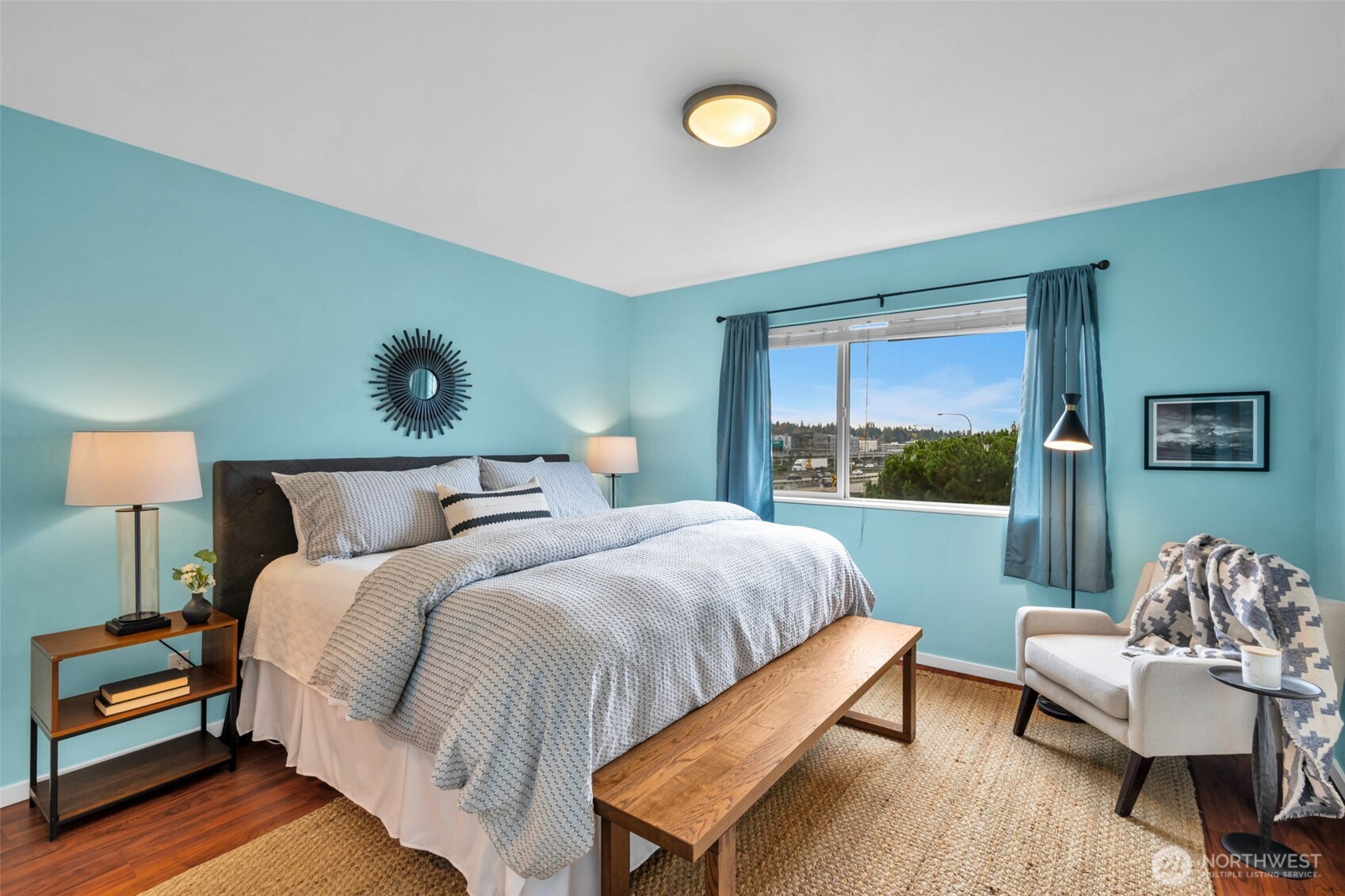 2311 North 113th Place, Unit B Seattle, WA 98133 - Photo 25 of 36 a bed room with a bed and a chair