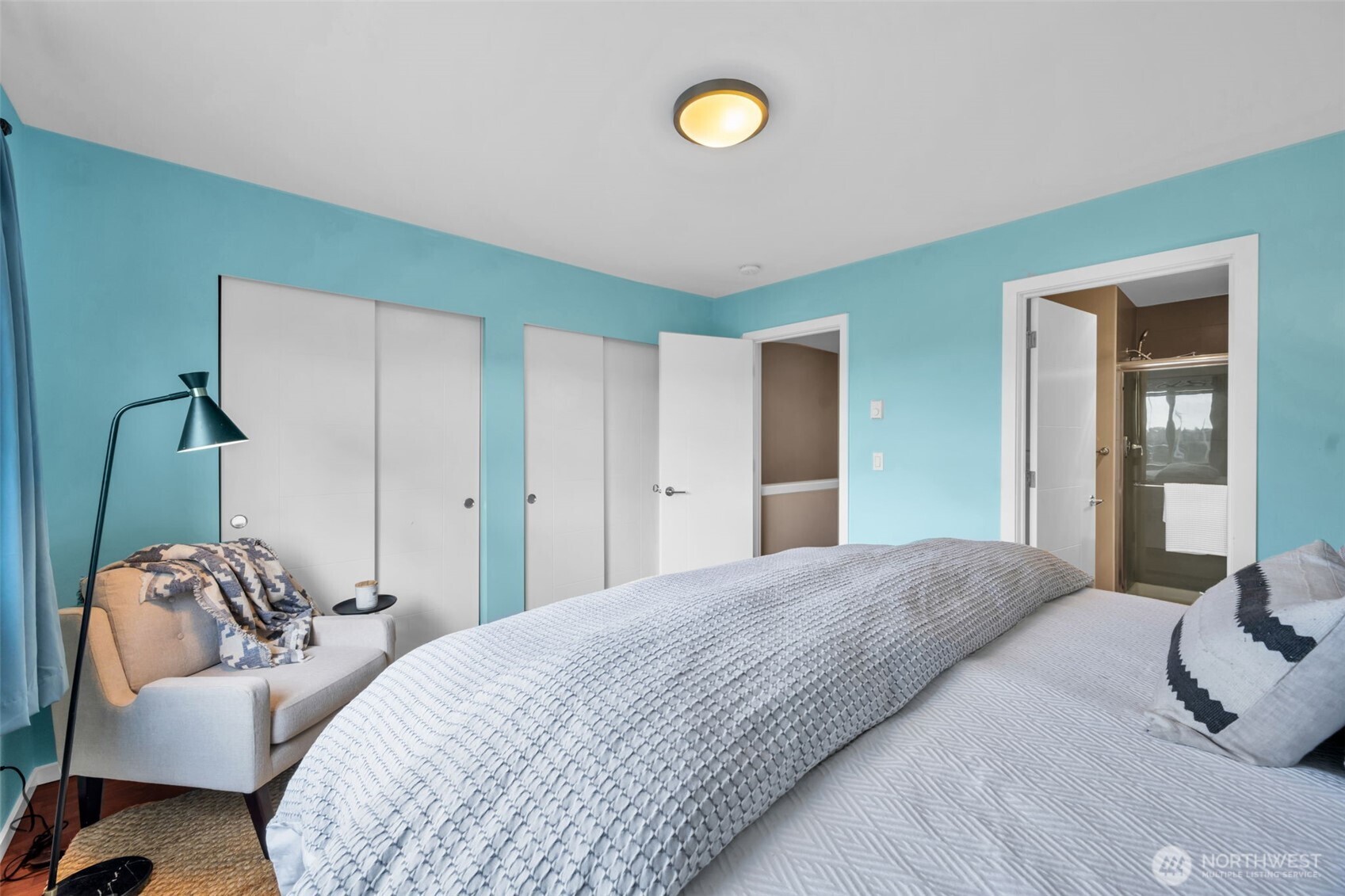 2311 North 113th Place, Unit B Seattle, WA 98133 - Photo 26 of 36 a bedroom with a bed and a couch