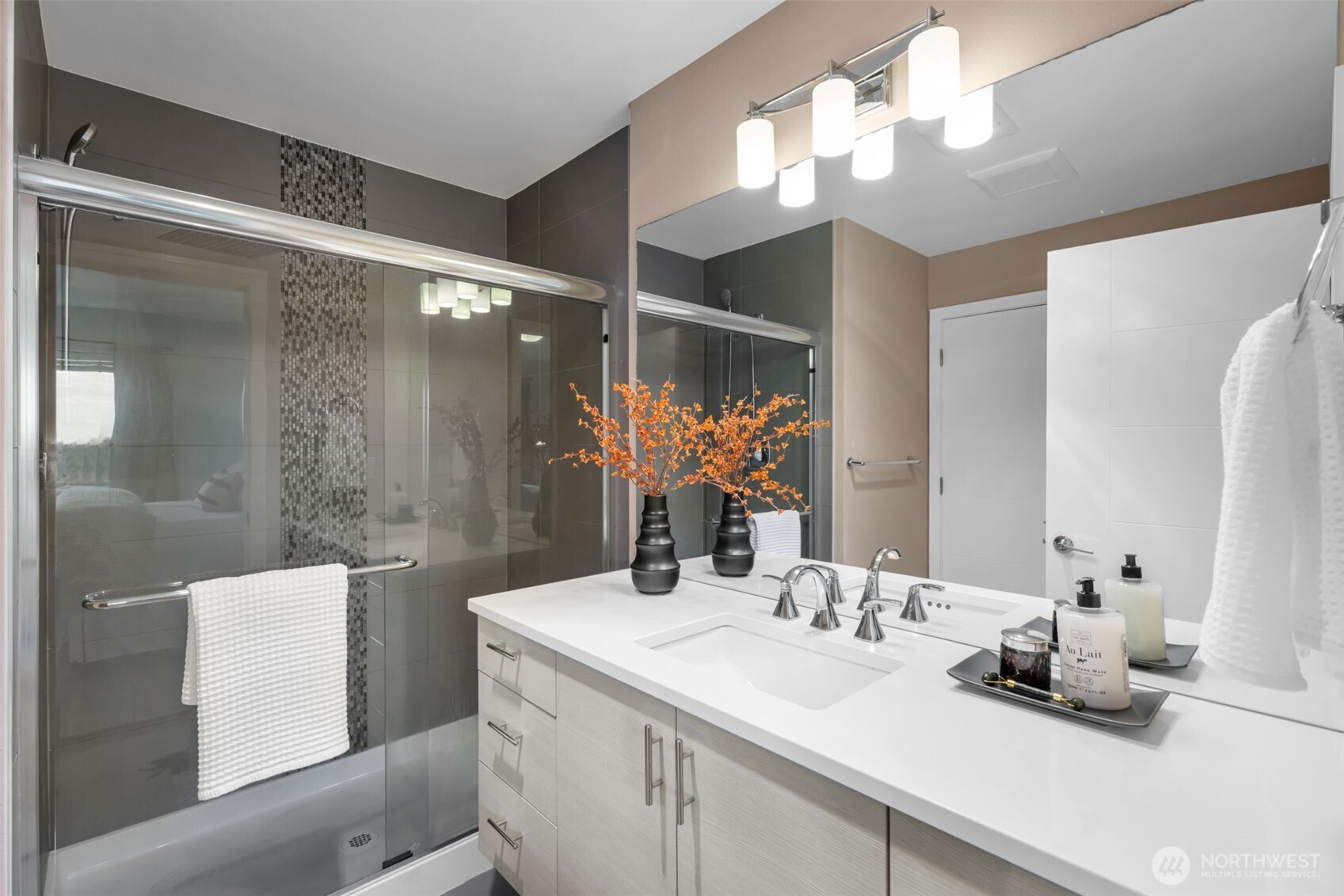 2311 North 113th Place, Unit B Seattle, WA 98133 - Photo 27 of 36 a bathroom with a sink and a mirror