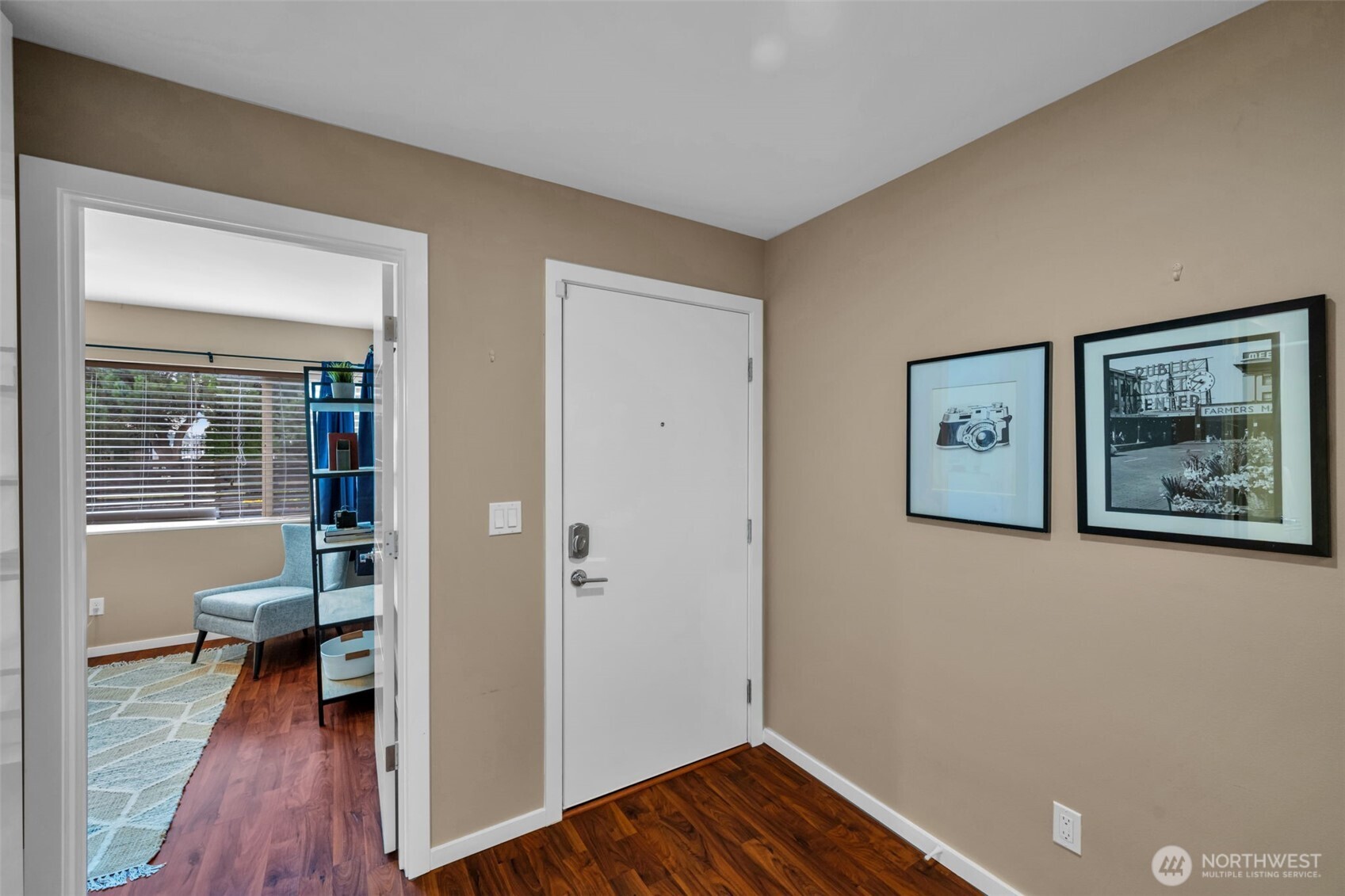 2311 North 113th Place, Unit B Seattle, WA 98133 - Photo 5 of 36 a view of a hallway with wooden floor and a workspace