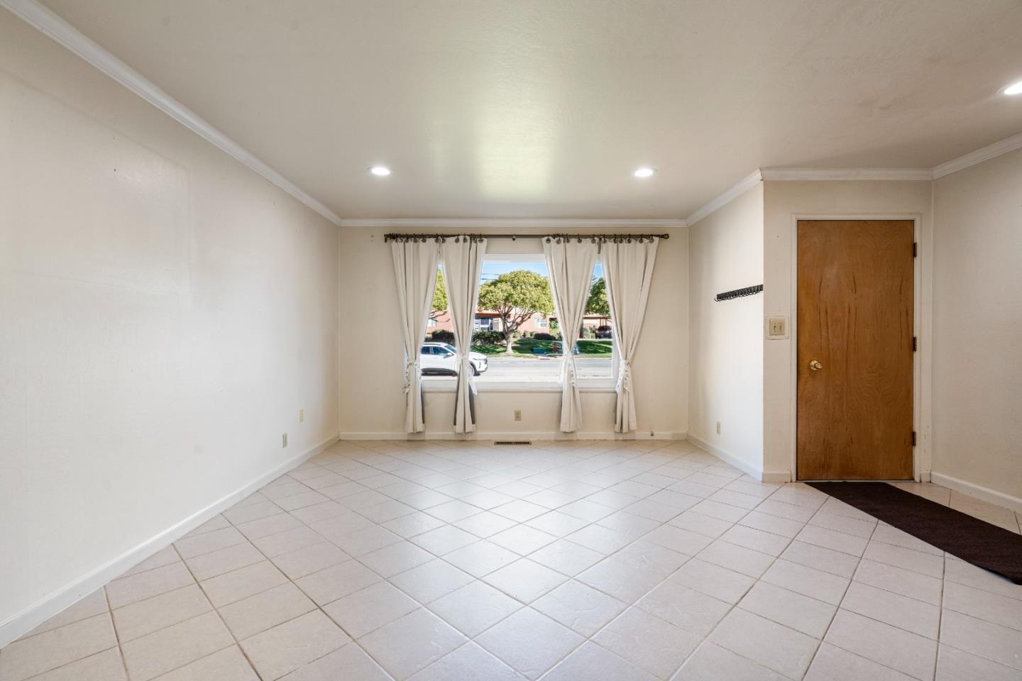641 Main Street Soledad, CA 93960 - Photo 9 of 46 a view of an empty room with a window