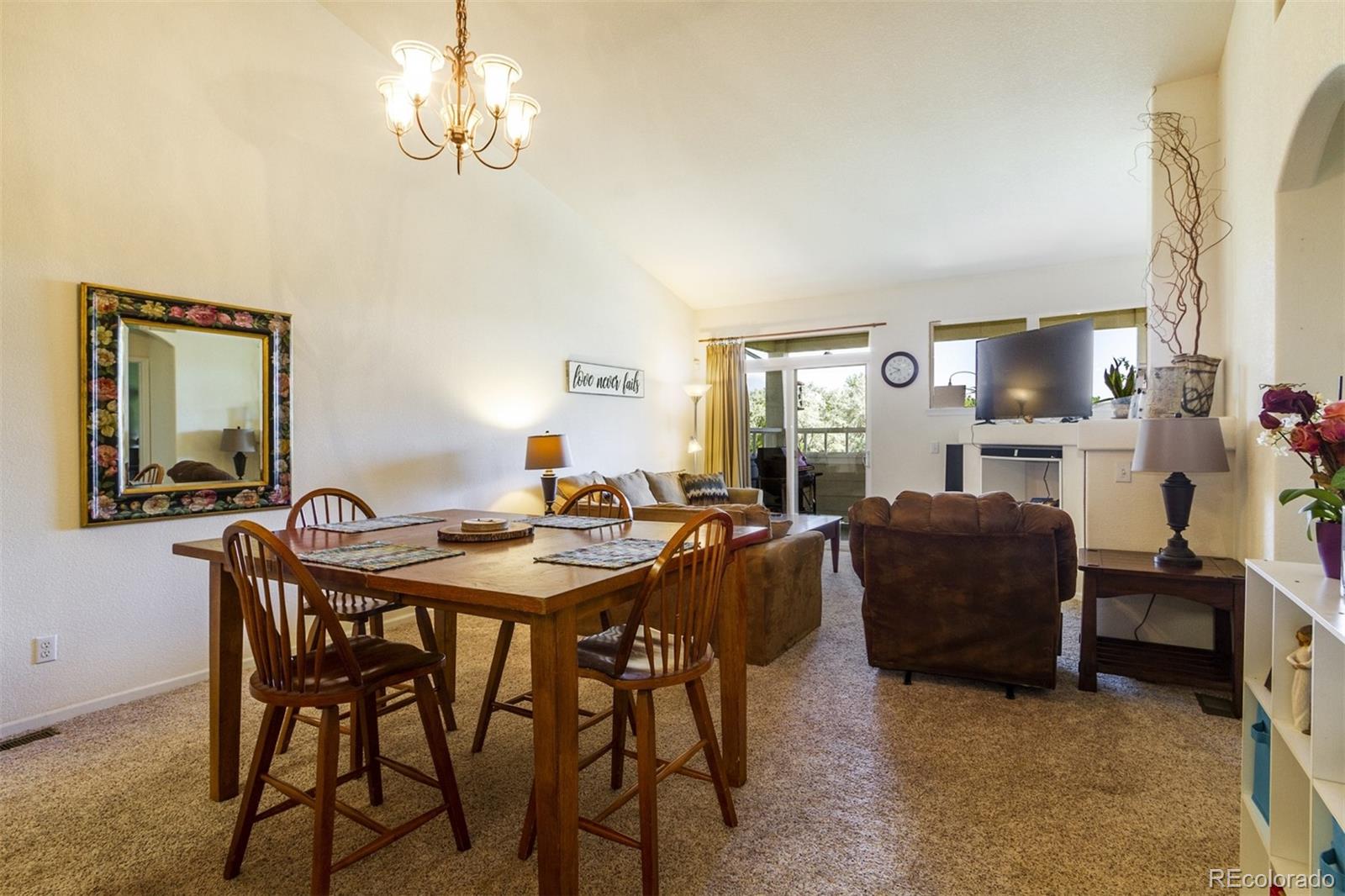 6697 South Reed Way, Unit B Littleton, CO 80123 - Photo 11 of 35 a dining room with furniture and window