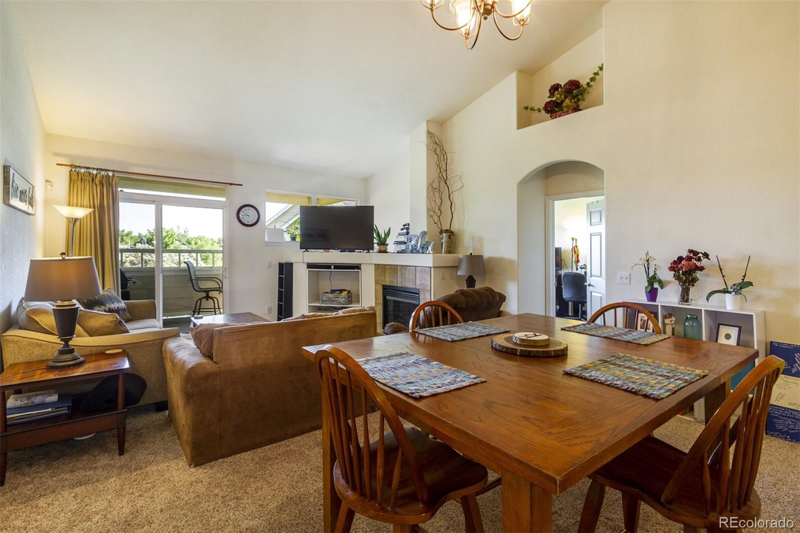6697 South Reed Way, Unit B Littleton, CO 80123 - Photo 12 of 35 a view of a dining room with furniture window and outside view