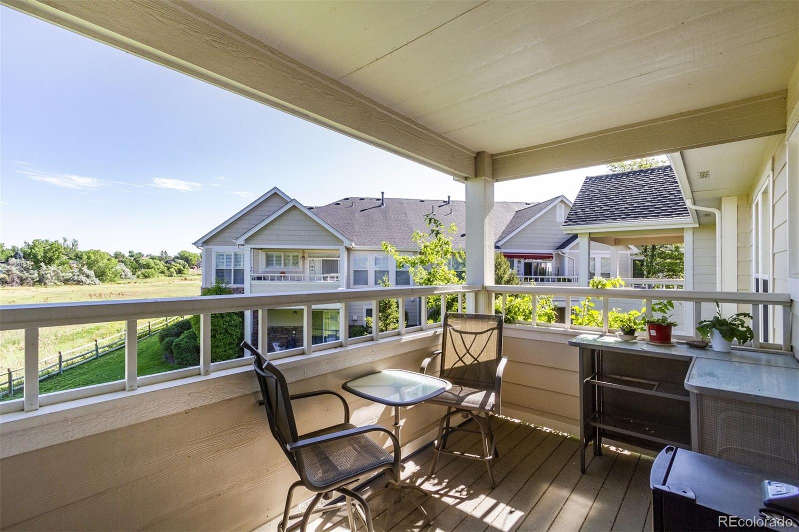 6697 South Reed Way, Unit B Littleton, CO 80123 - Photo 21 of 35 a view of a chairs and table in patio