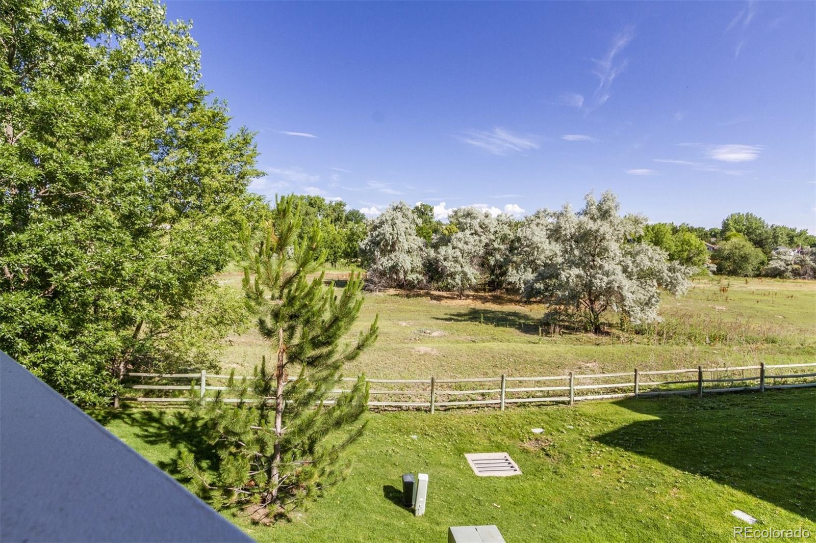 6697 South Reed Way, Unit B Littleton, CO 80123 - Photo 23 of 35 a view of an outdoor space and lakeside