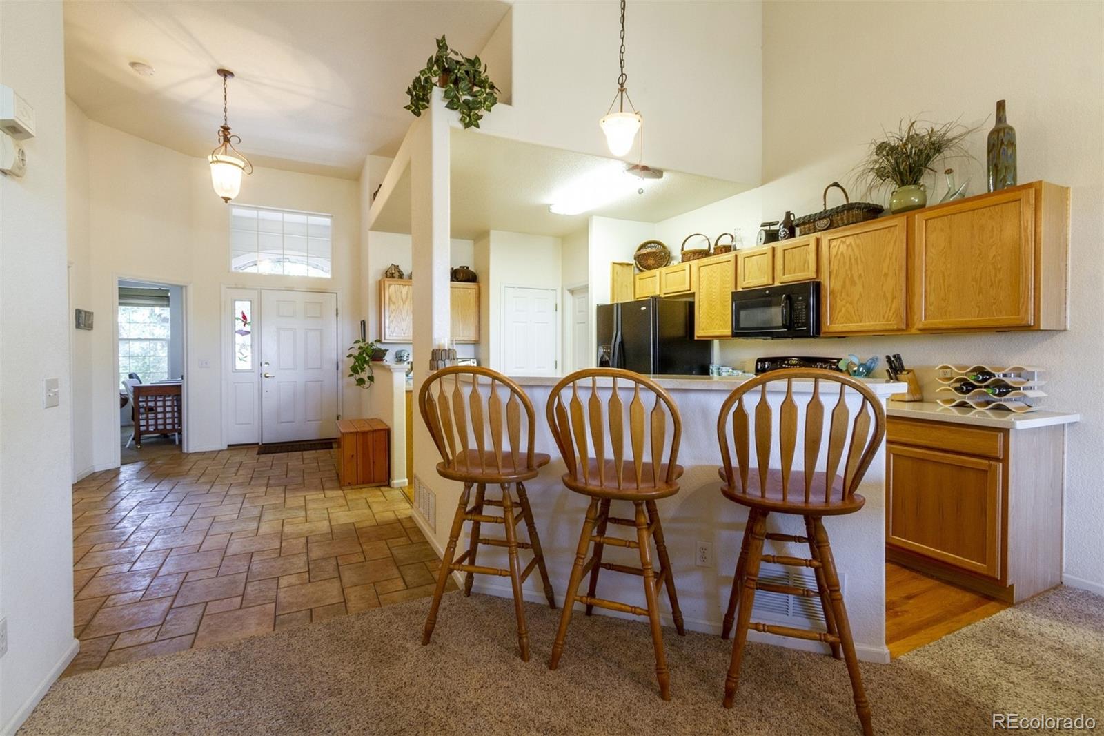 6697 South Reed Way, Unit B Littleton, CO 80123 - Photo 3 of 35 a view of a dining room with furniture