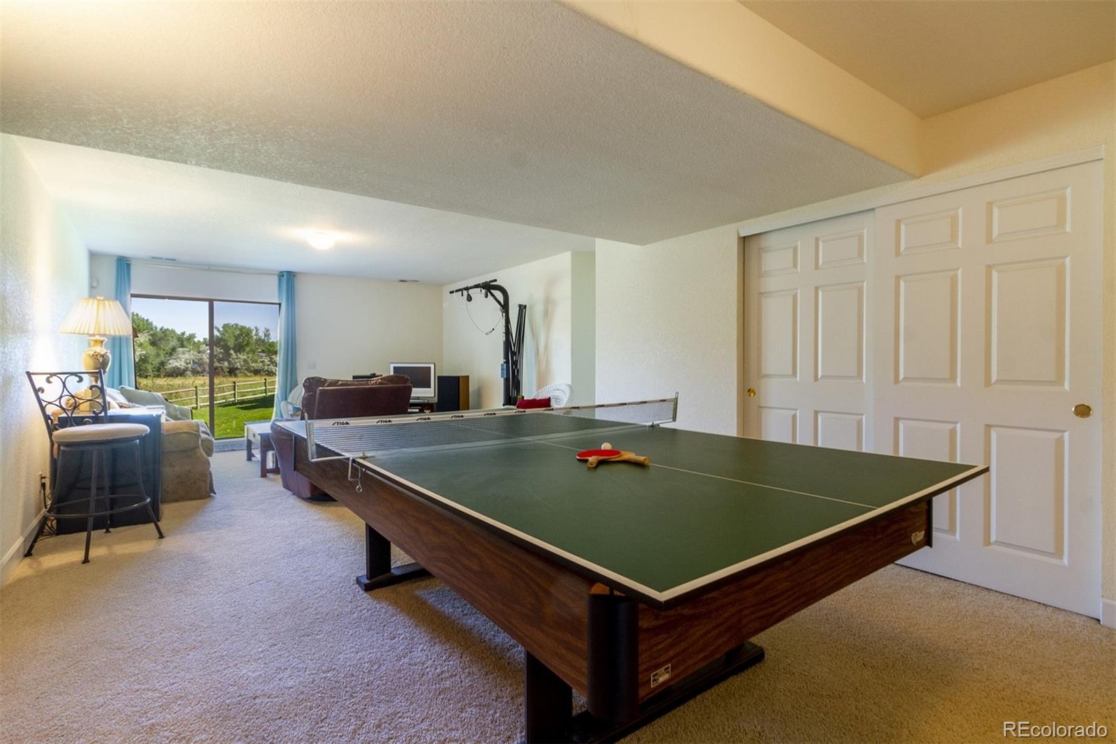 6697 South Reed Way, Unit B Littleton, CO 80123 - Photo 33 of 35 a room with pool table and windows