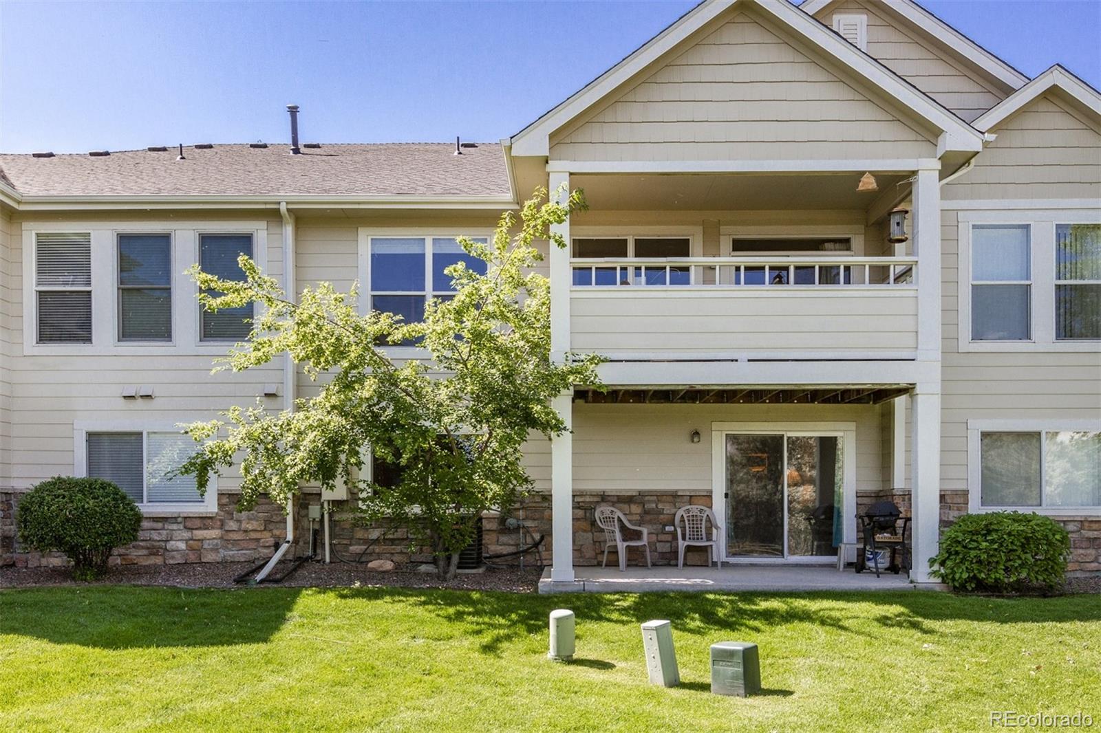 6697 South Reed Way, Unit B Littleton, CO 80123 - Photo 35 of 35 a view of a house with swimming pool and a yard