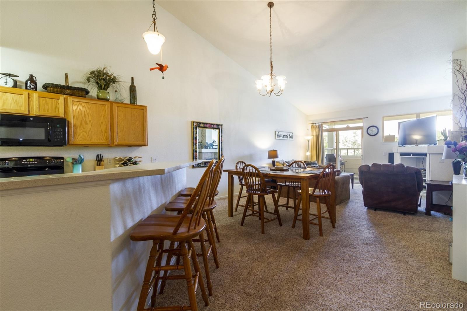 6697 South Reed Way, Unit B Littleton, CO 80123 - Photo 6 of 35 a view of kitchen with breakfast area