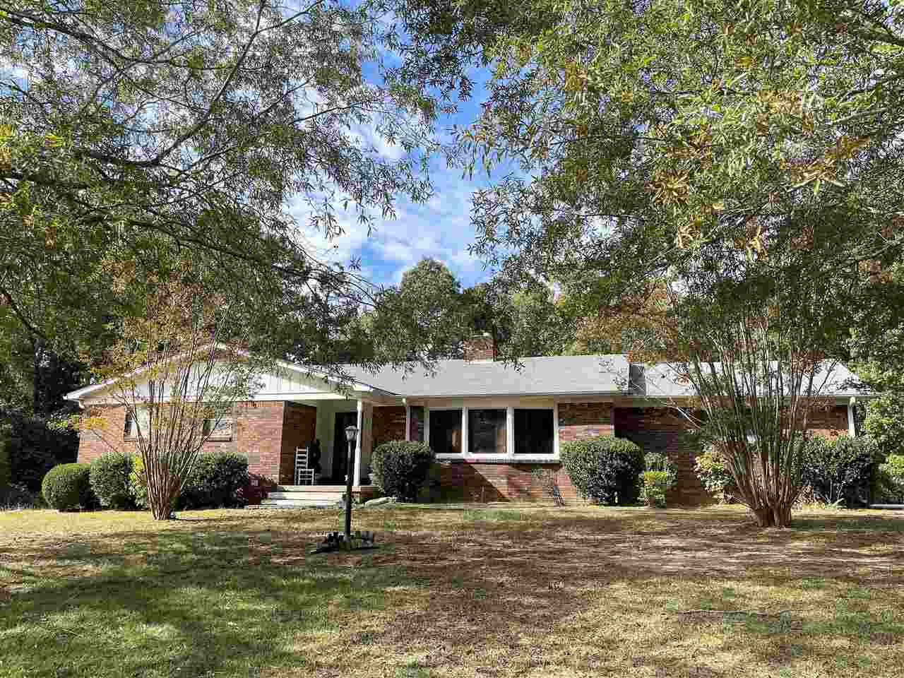 3990 Ebenezer Road Toone, TN 38381 - Photo 1 of 21 a front view of a house with a yard