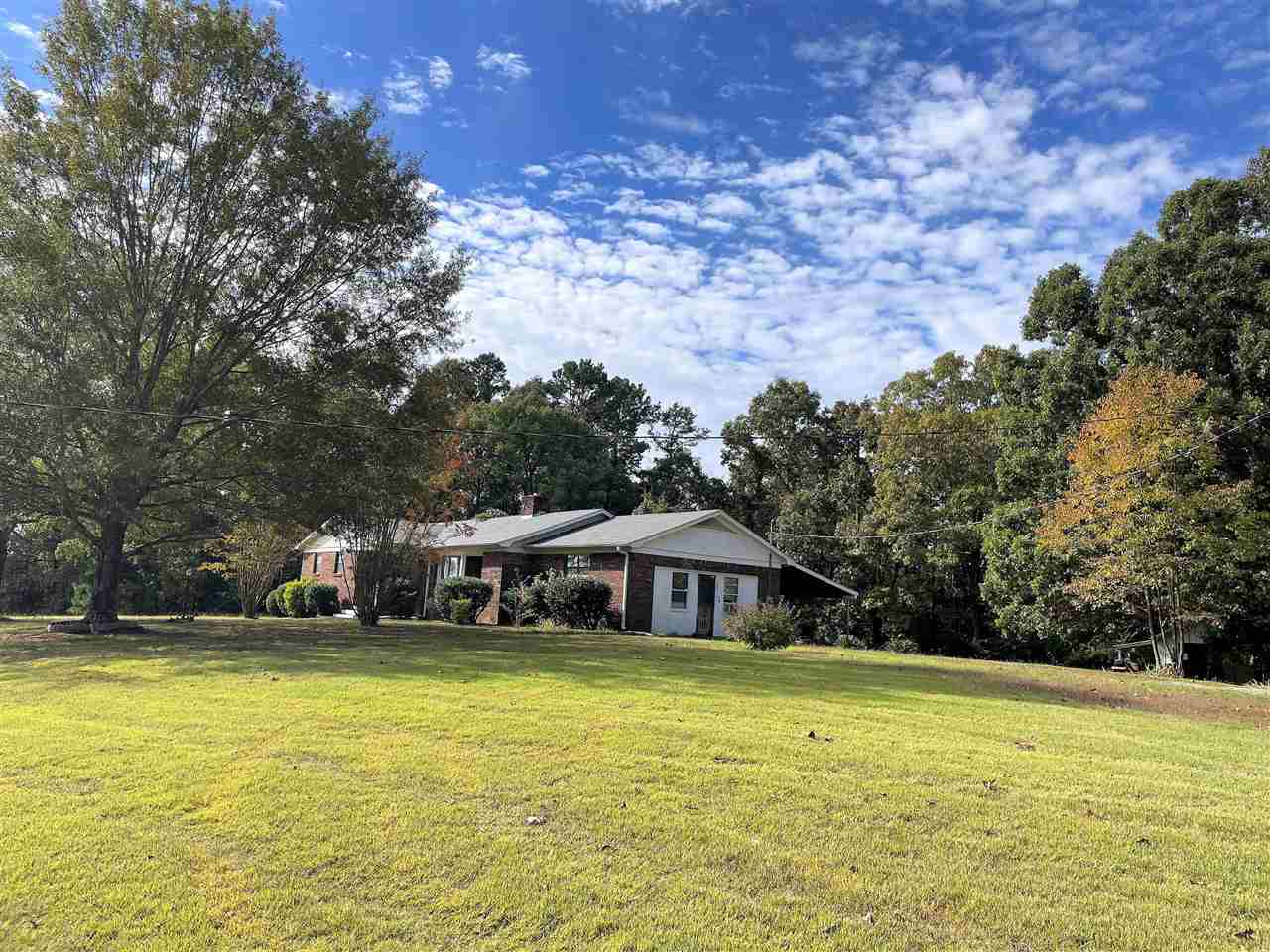 3990 Ebenezer Road Toone, TN 38381 - Photo 2 of 21 a front view of a house with a swimming pool