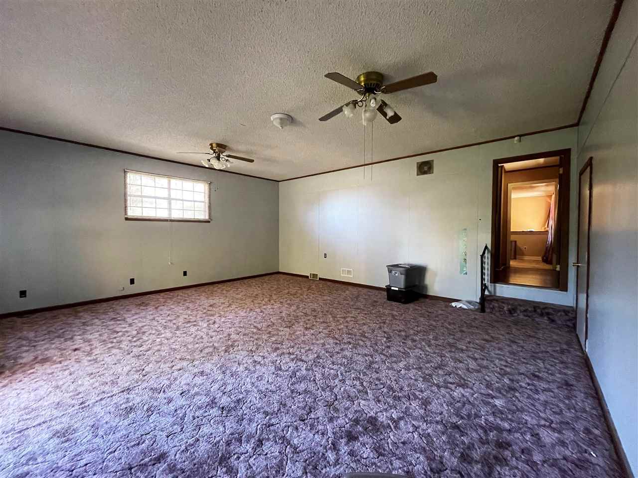 3990 Ebenezer Road Toone, TN 38381 - Photo 11 of 21 a view of a livingroom with a staircase