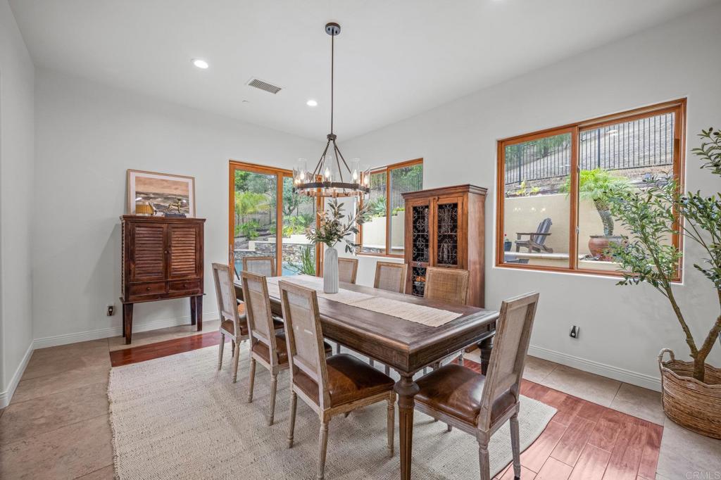 4149 Manchester Avenue Encinitas, CA 92024 - Photo 11 of 60 a view of a dining room with furniture window and wooden floor