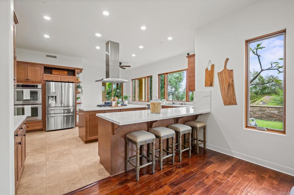 4149 Manchester Avenue Encinitas, CA 92024 - Photo 19 of 60 a large kitchen with a table and chairs
