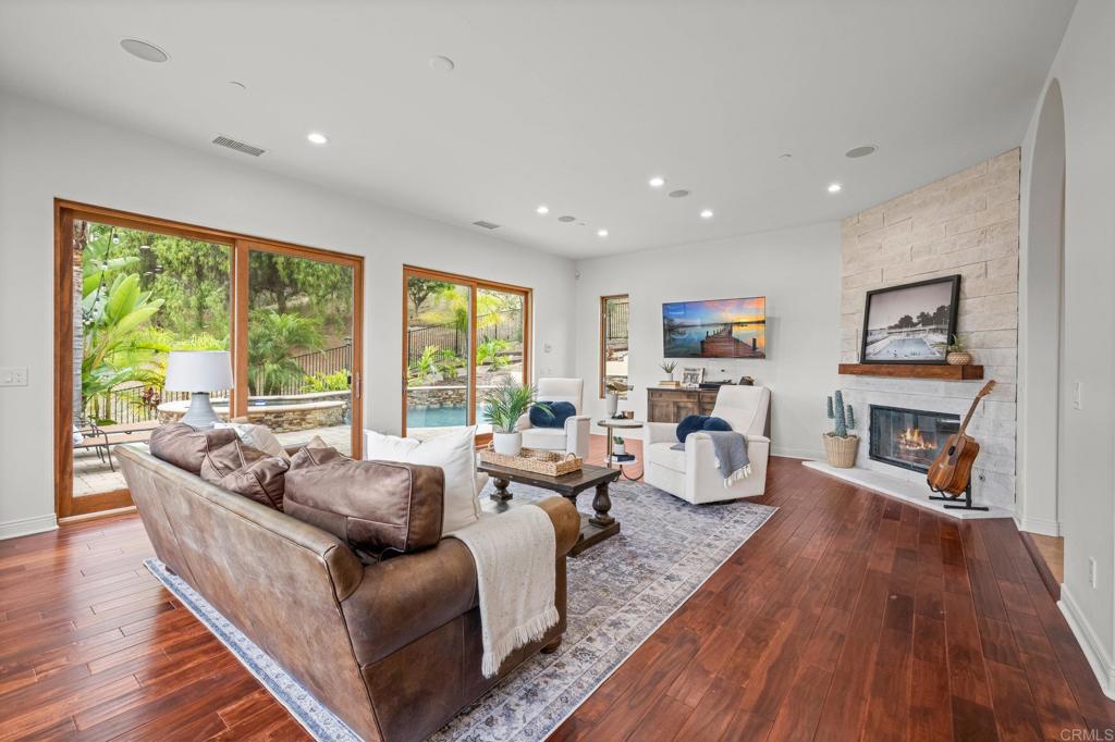 4149 Manchester Avenue Encinitas, CA 92024 - Photo 22 of 60 a living room with furniture and a wooden floor