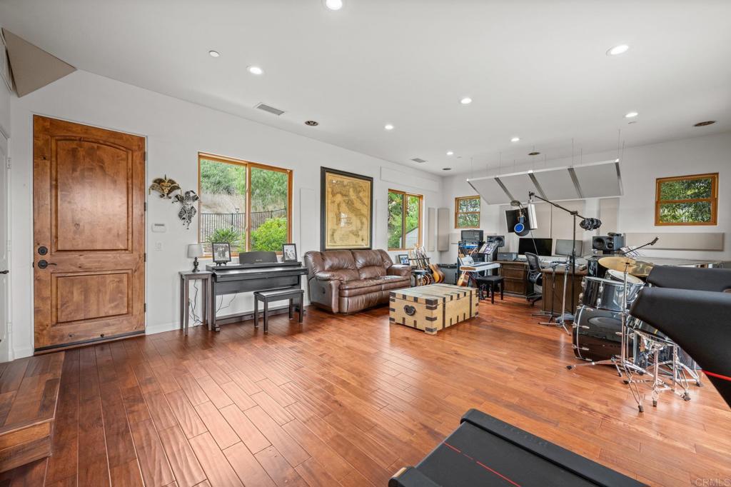 4149 Manchester Avenue Encinitas, CA 92024 - Photo 39 of 60 a living room with furniture a wooden floor and a window