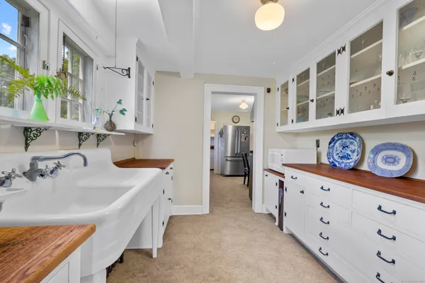 a spacious bathroom with a double vanity sink and a tub