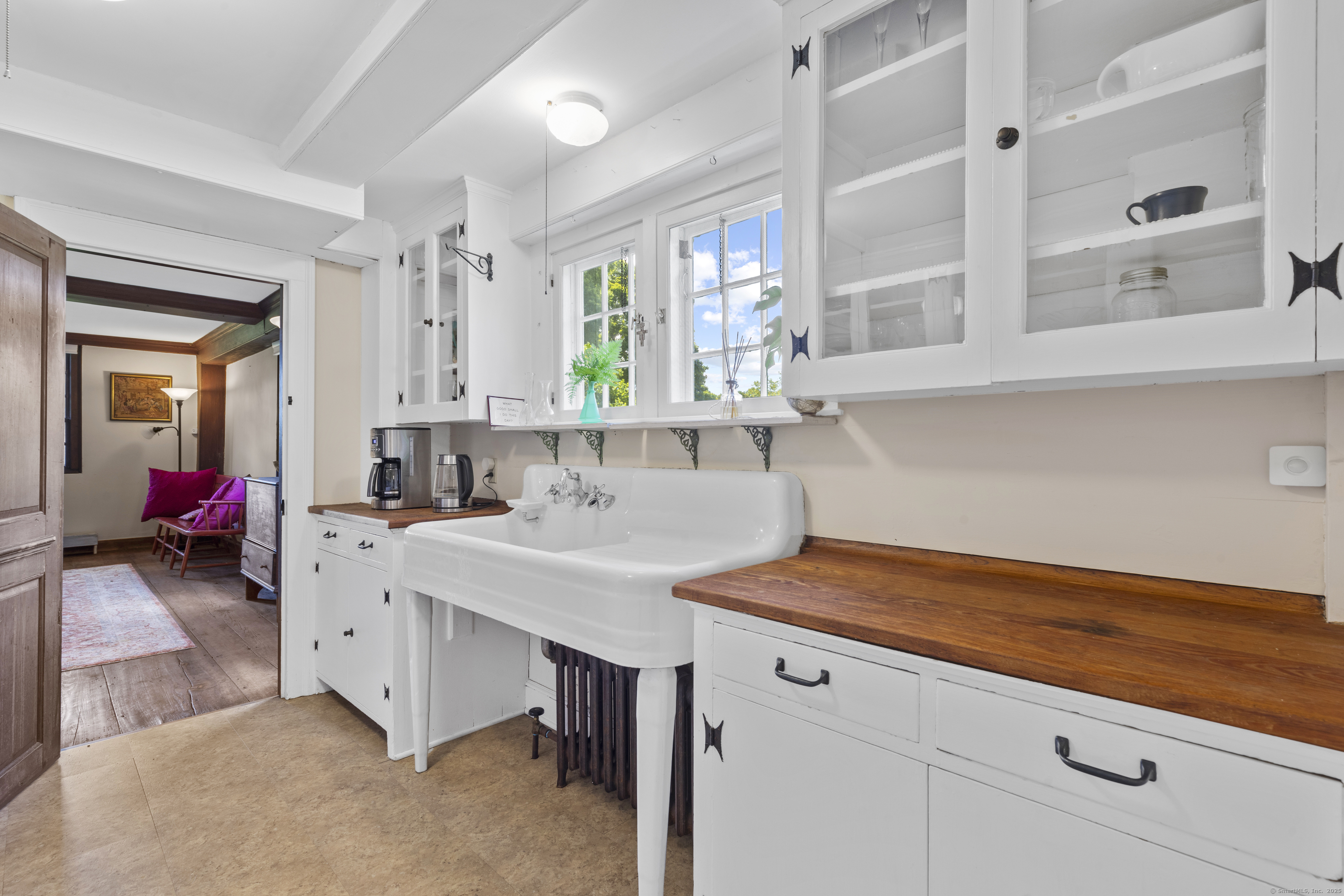 90 Duck Hole Road Guilford, CT 06437 - Photo 15 of 38 a view of cabinets a sink and dishwasher with wooden floor