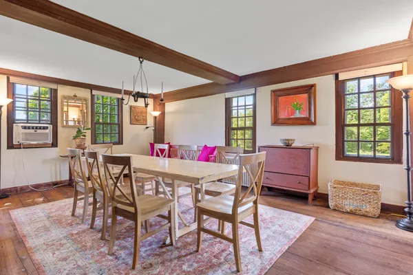 a dining room with furniture and window