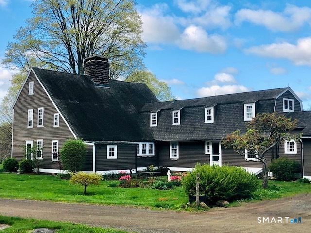 90 Duck Hole Road Guilford, CT 06437 - Photo 2 of 38 a front view of a house with garden