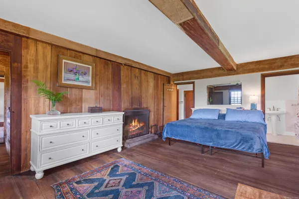 a bedroom with a bed and a dresser