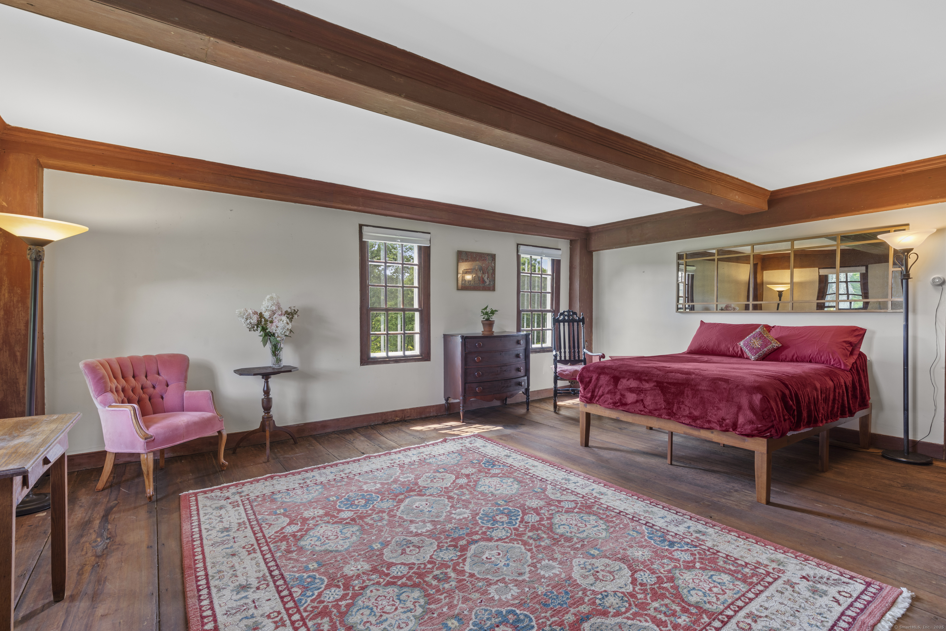 90 Duck Hole Road Guilford, CT 06437 - Photo 30 of 38 a bedroom with a bed and wooden floor