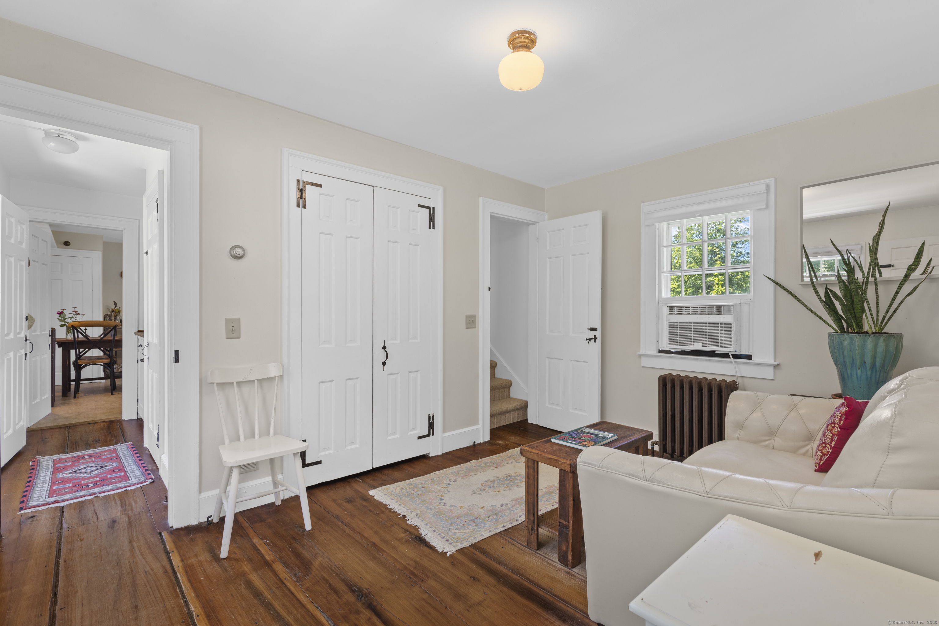 90 Duck Hole Road Guilford, CT 06437 - Photo 37 of 38 a living room with furniture and a wooden floor