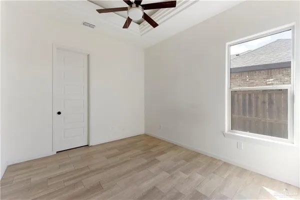 a view of empty room with windows