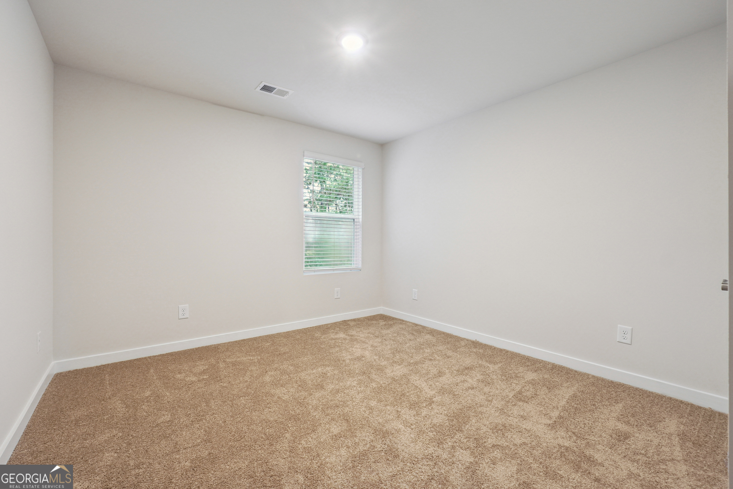 201 Harris Walk, Unit 20 West Point, GA 31833 - Photo 12 of 25 an empty room with windows