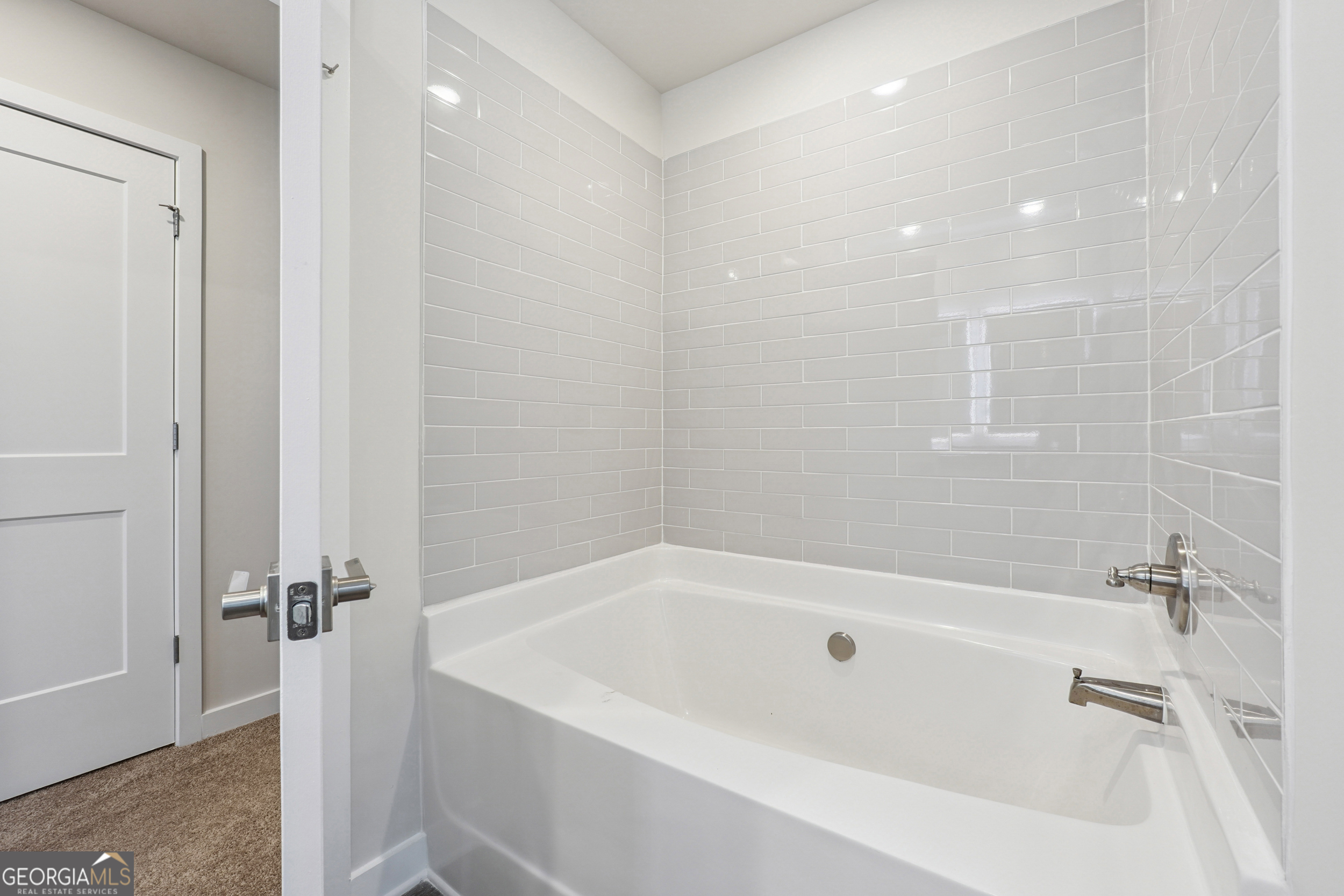 201 Harris Walk, Unit 20 West Point, GA 31833 - Photo 16 of 25 a white bath tub sitting next to a white sink