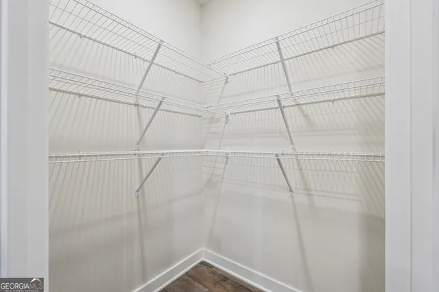 a bathroom with a sink a mirror and a a window