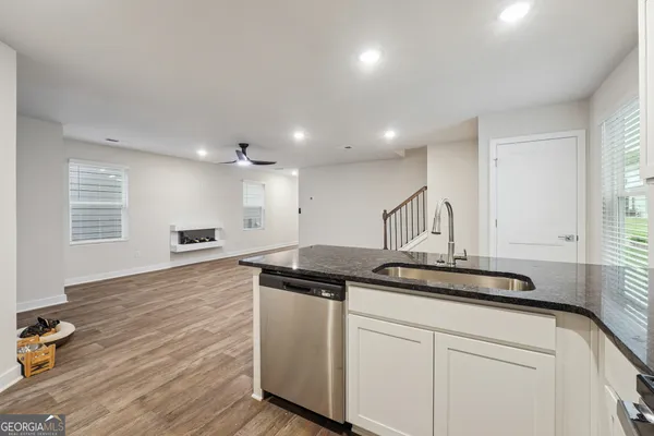 a kitchen with a sink and cabinets
