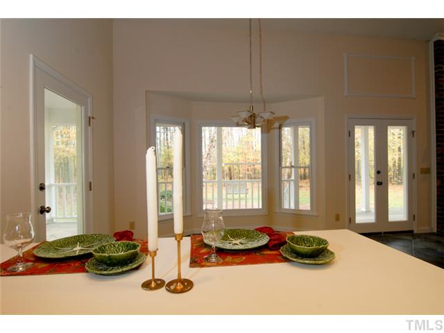 676 Highland Road Apex, NC 27523 - Photo 8 of 19 Wonderful space for a breakfast table or for a quick bite the breakfast bar is perfect.