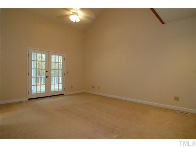 676 Highland Road Apex, NC 27523 - Photo 10 of 19 A master on the main floor which offers easy acces to the rear porch.