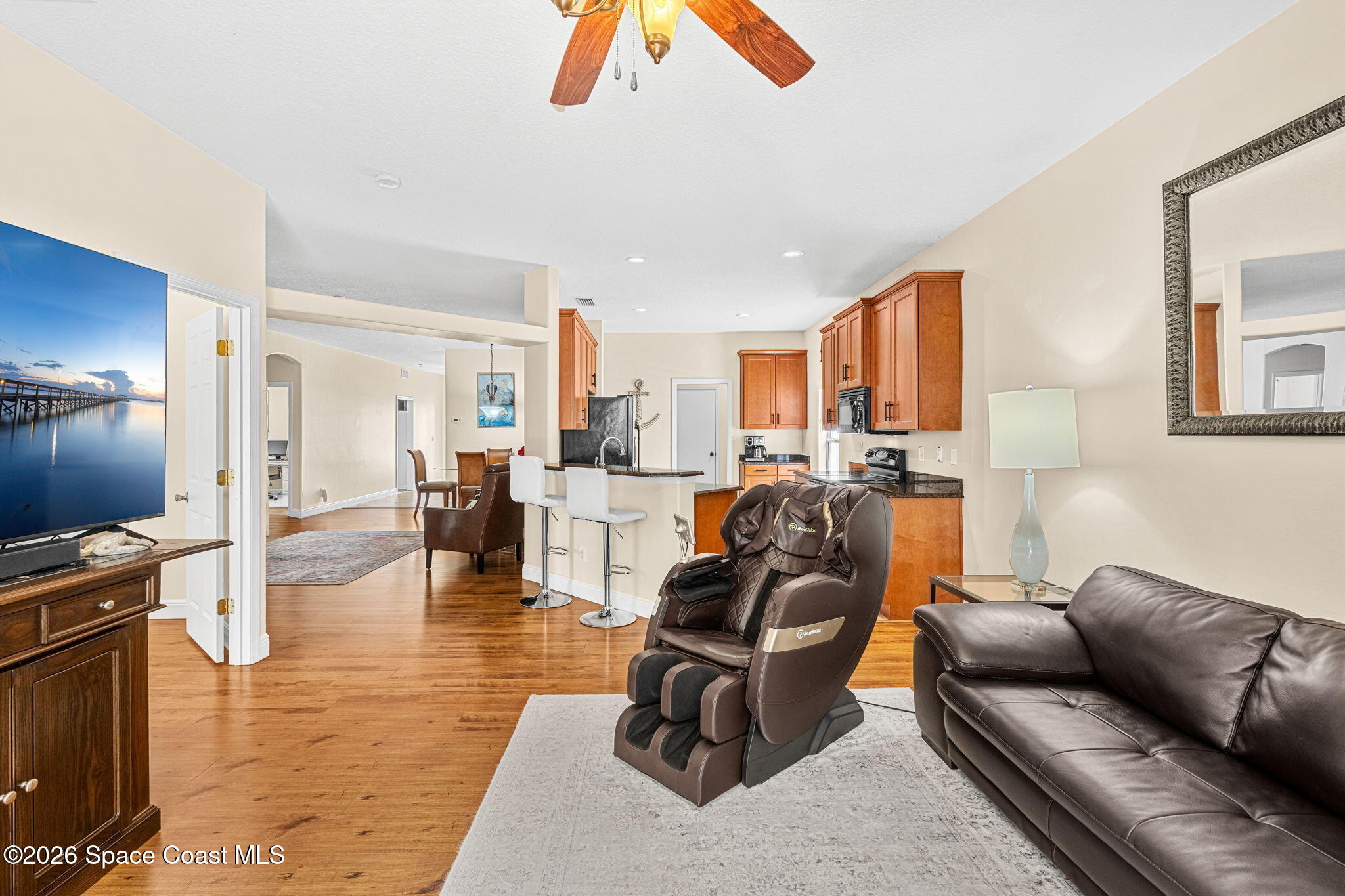 3751 Manitoba Way Rockledge, FL 32955 - Photo 14 of 64 a living room with furniture gym equipment and a view of kitchen