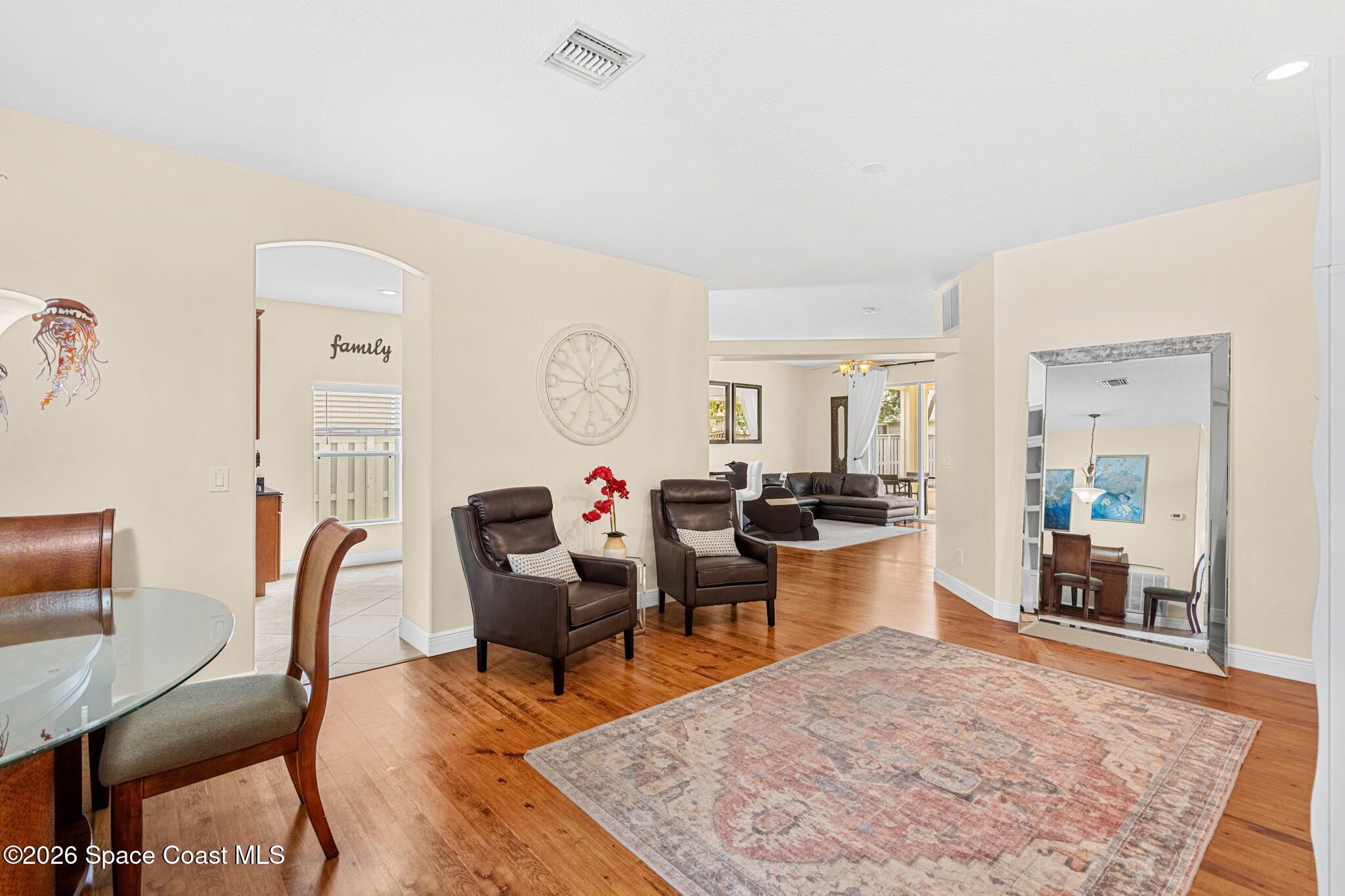 3751 Manitoba Way Rockledge, FL 32955 - Photo 21 of 64 a living room with furniture a rug and a dining table