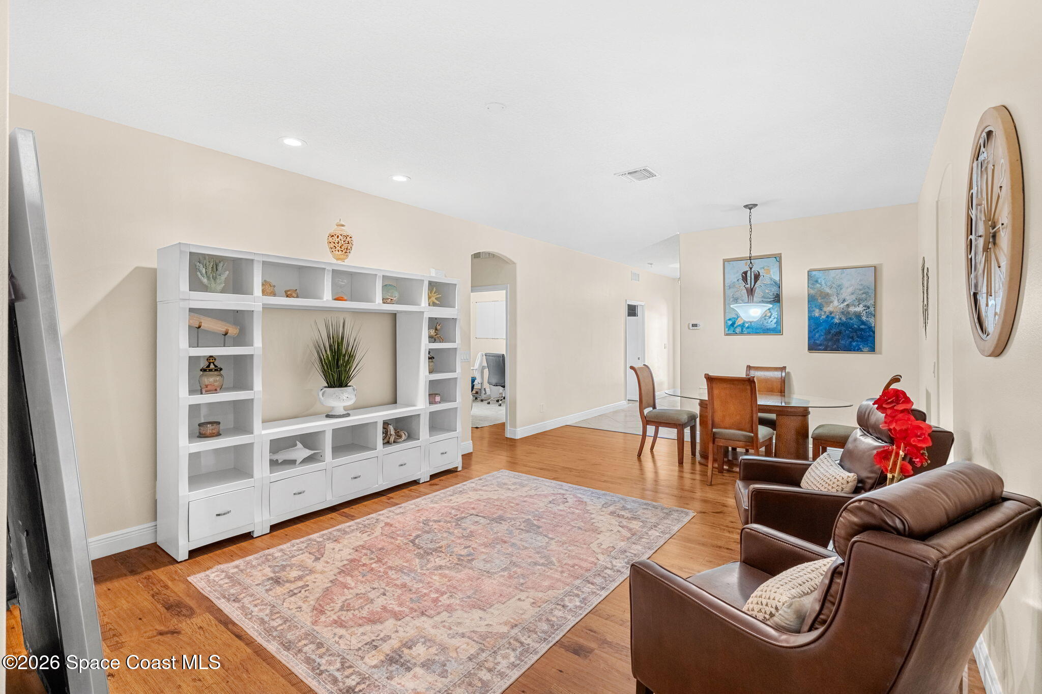 3751 Manitoba Way Rockledge, FL 32955 - Photo 27 of 64 a living room with furniture and a flat screen tv