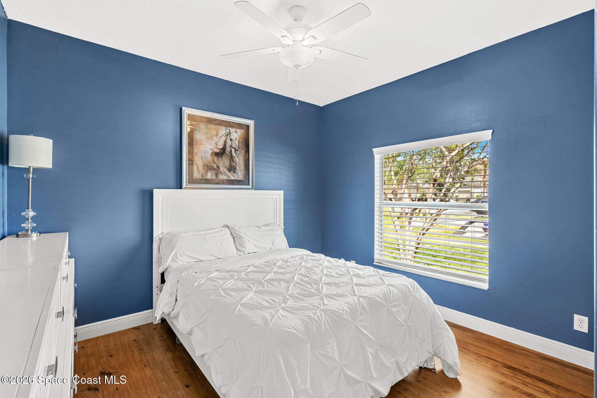 3751 Manitoba Way Rockledge, FL 32955 - Photo 29 of 64 a large bed sitting in a bedroom next to a window