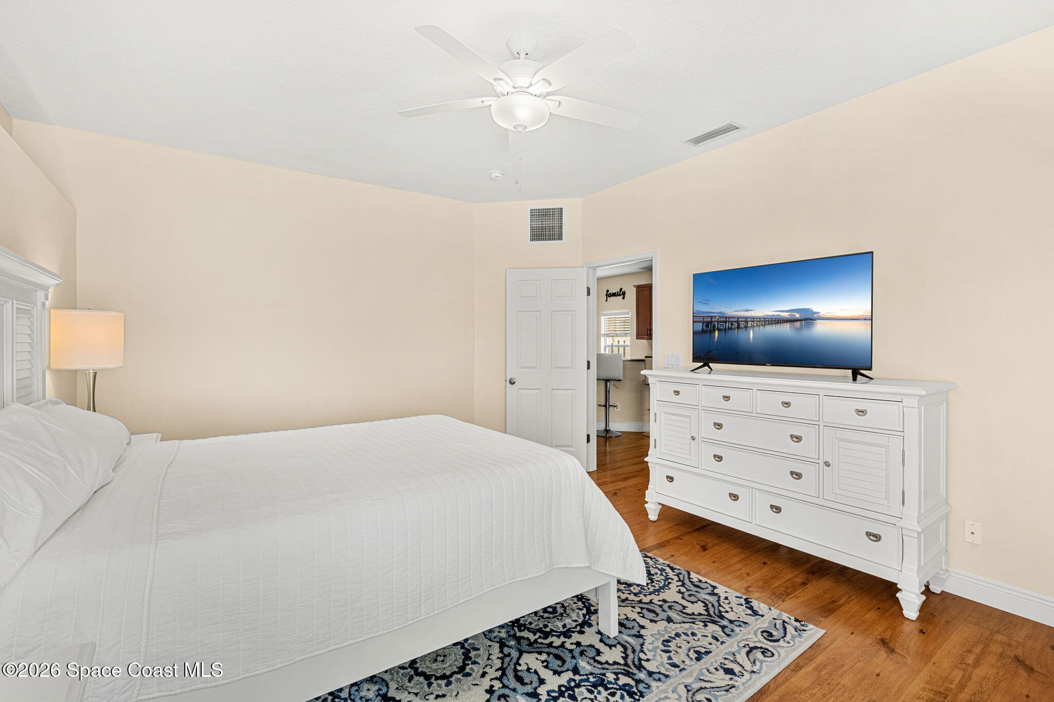 3751 Manitoba Way Rockledge, FL 32955 - Photo 31 of 64 a bedroom with a bed and flat screen tv