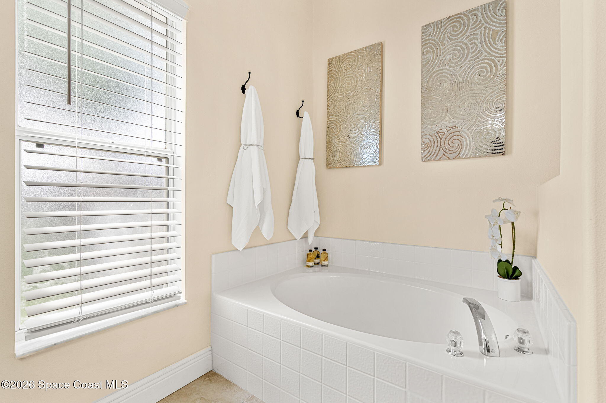 3751 Manitoba Way Rockledge, FL 32955 - Photo 34 of 64 a white bath tub sitting next to a white sink