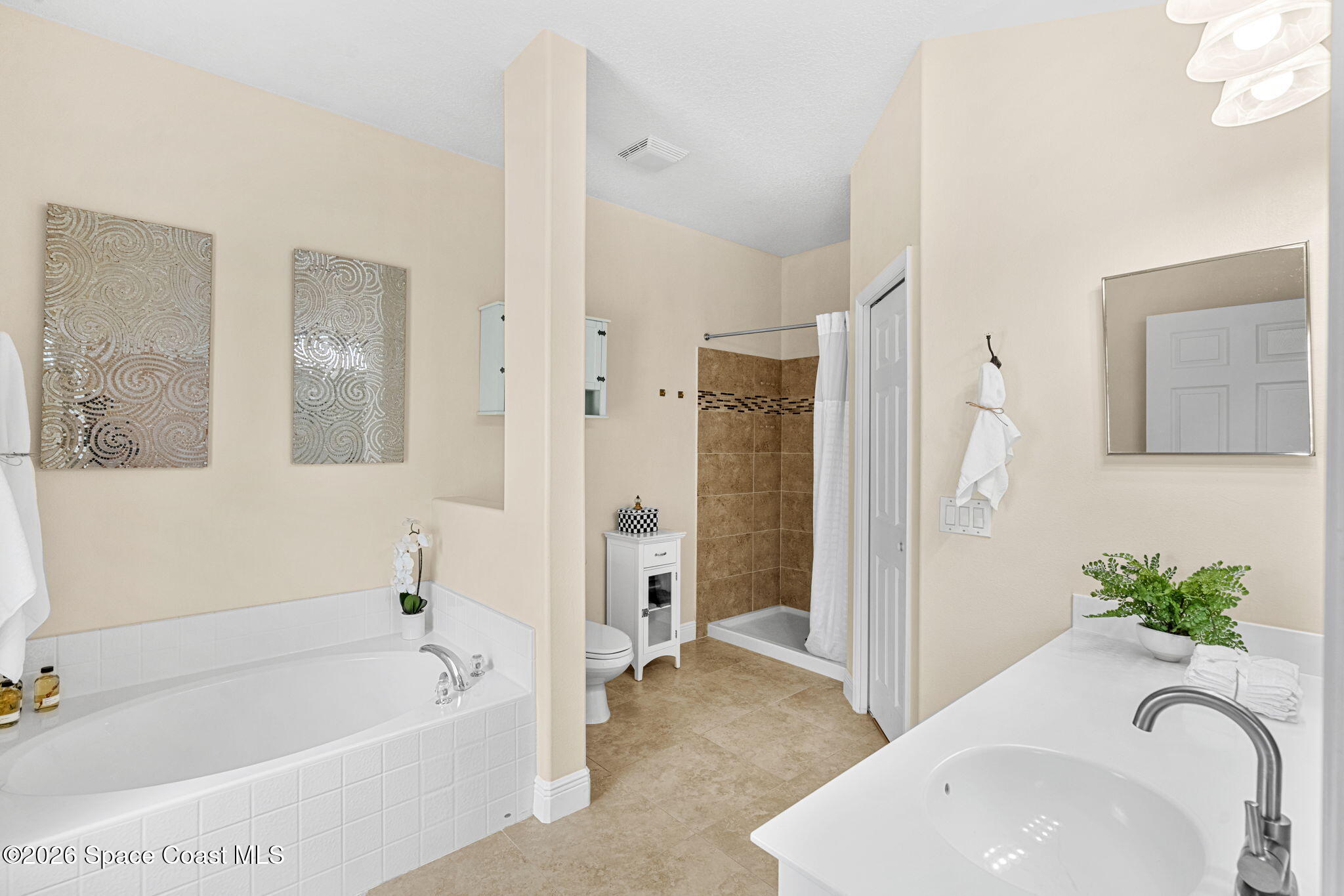 3751 Manitoba Way Rockledge, FL 32955 - Photo 35 of 64 a white bath tub sitting next to a white sink