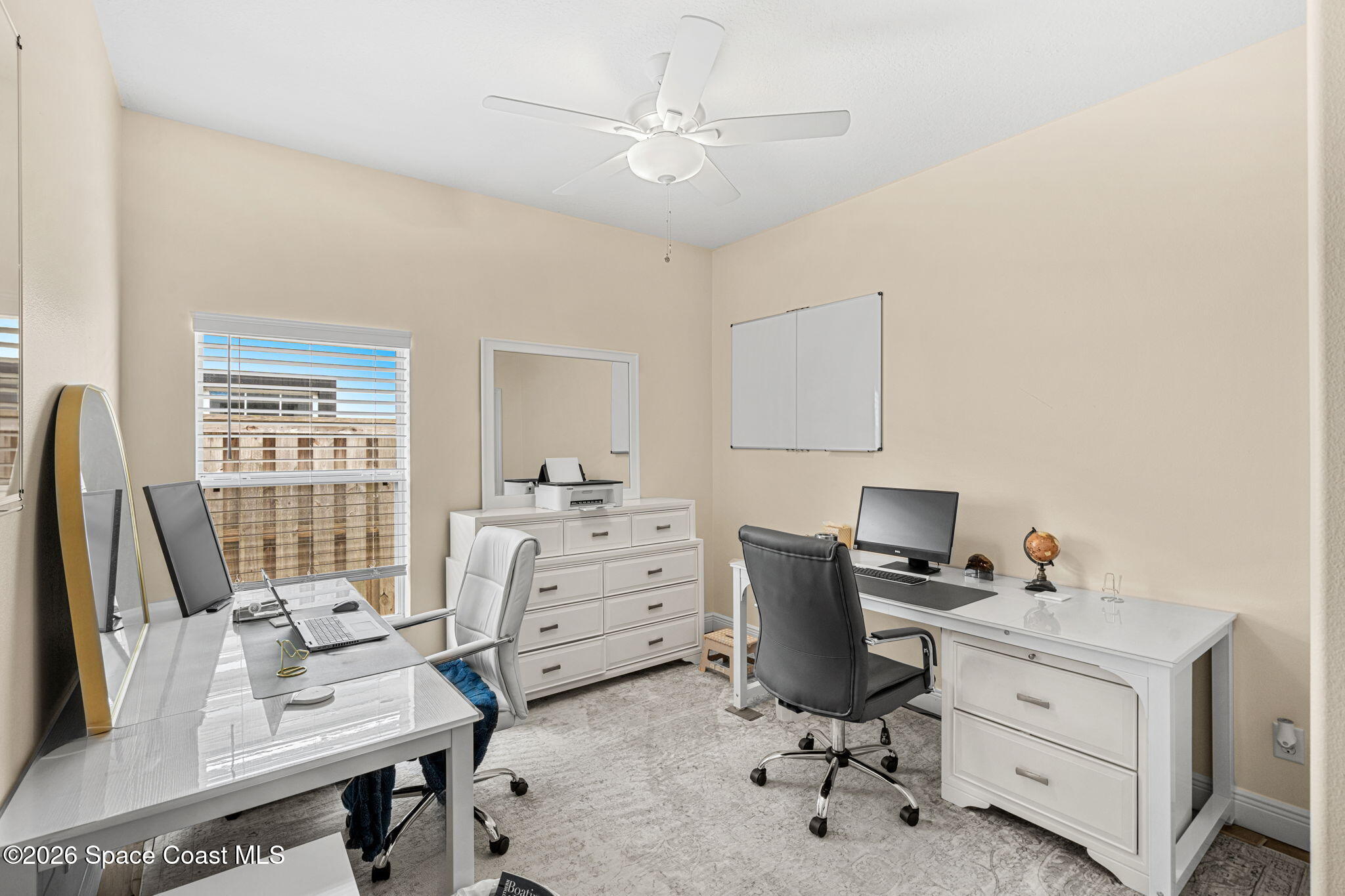 3751 Manitoba Way Rockledge, FL 32955 - Photo 36 of 64 a view of a workspace with furniture and a window